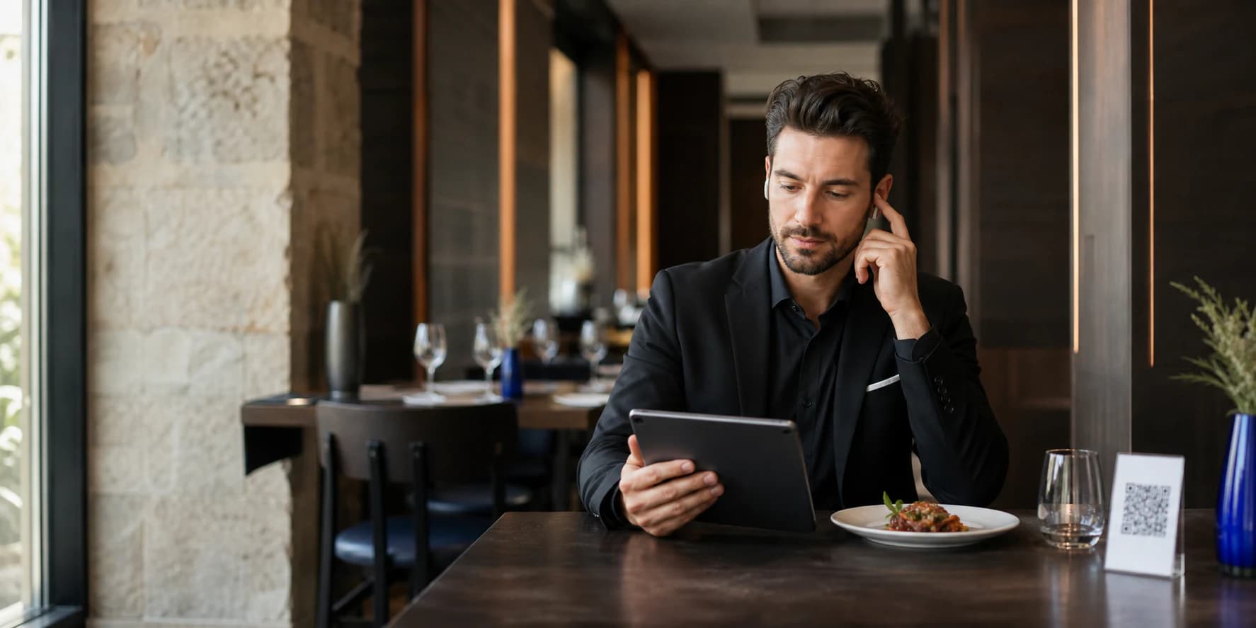 Restaurant manager using Menu Plus on a tablet